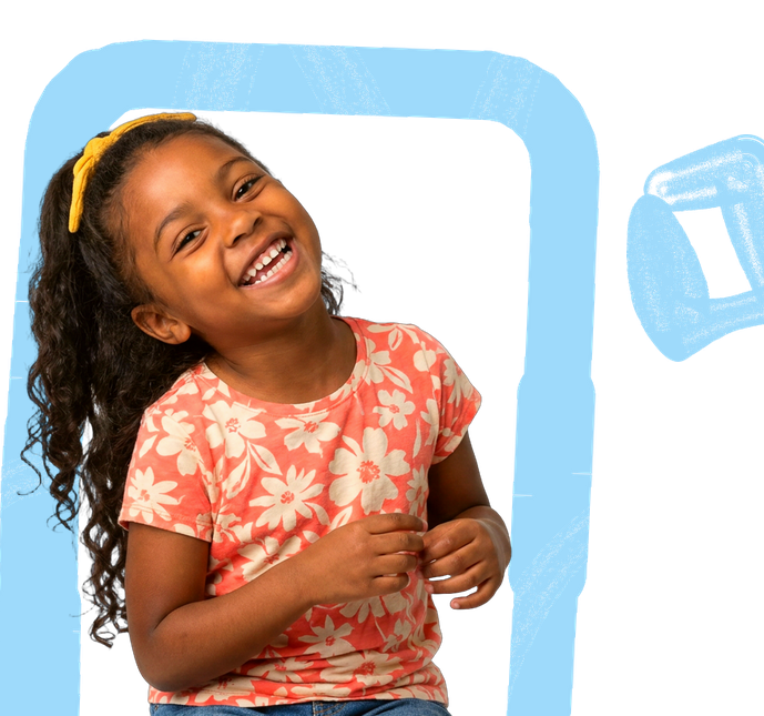 A young child smiling during a play-based ABA therapy session at ANNA